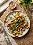 Запечённый кабачок с нутом и соусом из тахини