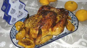 Курица с мандаринами, запеченная в духовке