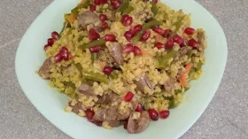 Тушеные куриные сердечки с булгуром и овощами