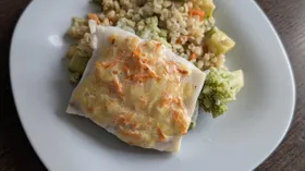 Треска в морковной шубке с гарниром из овощей и булгура