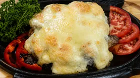 Свинина с грибами и сыром в духовке